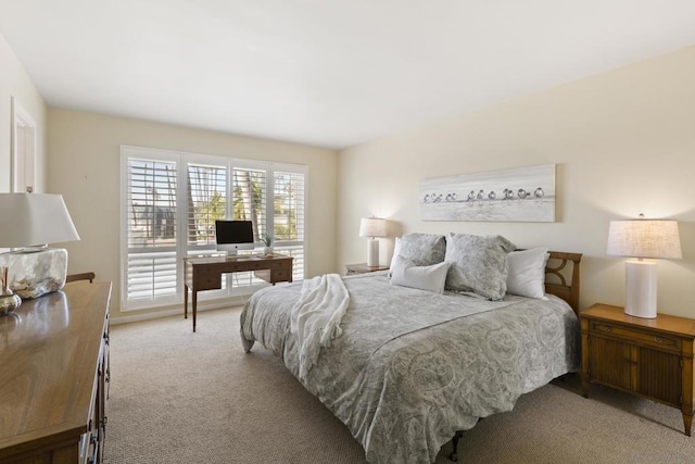 bedroom featuring light colored carpet