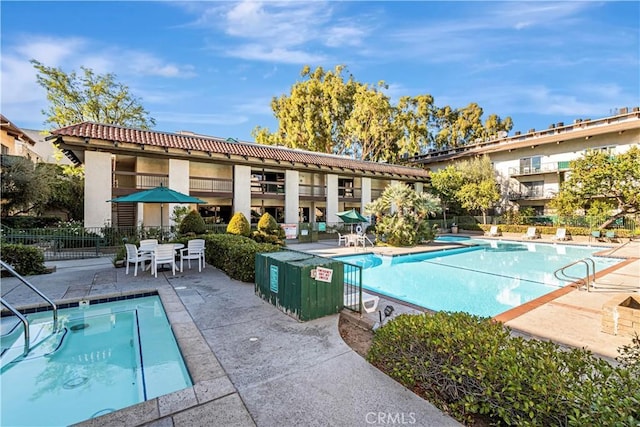 view of swimming pool featuring a patio area