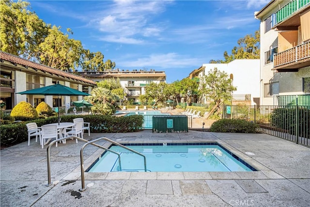 view of pool featuring a patio area