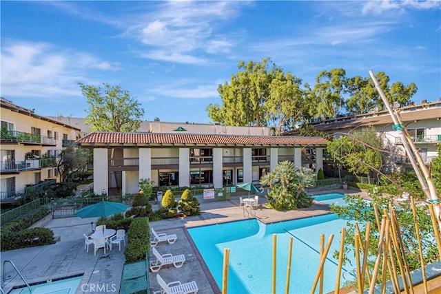 view of pool featuring a patio