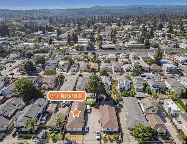 birds eye view of property with a mountain view