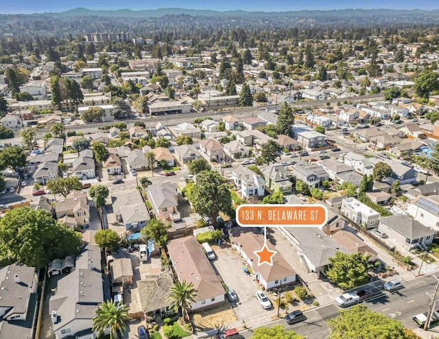 birds eye view of property featuring a mountain view