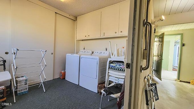 laundry area featuring cabinets and washing machine and clothes dryer