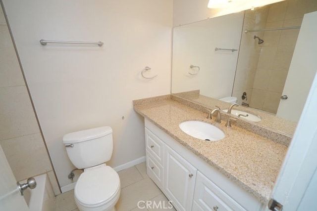 bathroom featuring toilet, vanity, and tile patterned floors