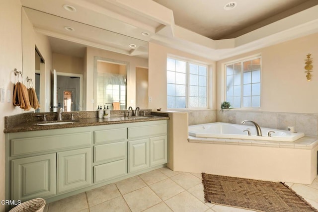 bathroom featuring vanity, tiled bath, and tile patterned floors