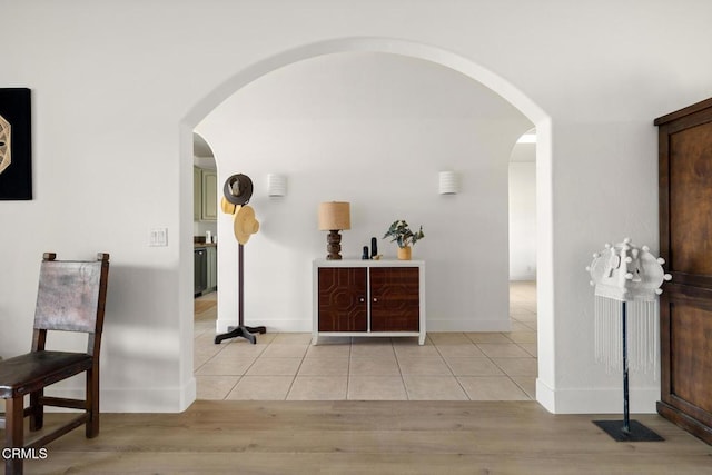 corridor featuring light tile patterned flooring