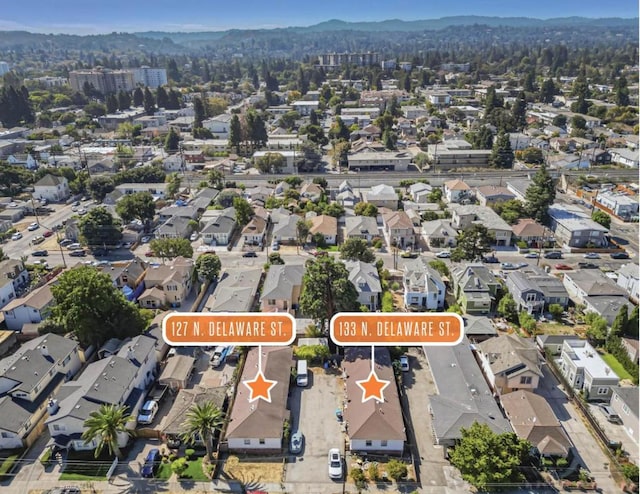 birds eye view of property with a mountain view