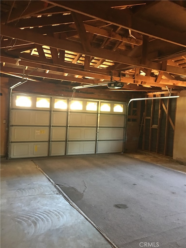 garage featuring a garage door opener