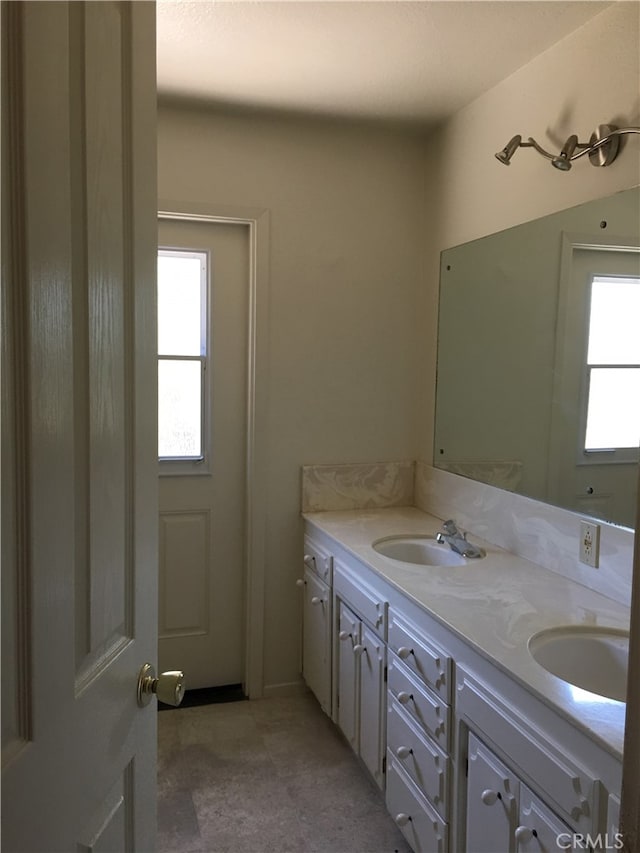 bathroom with vanity and a wealth of natural light