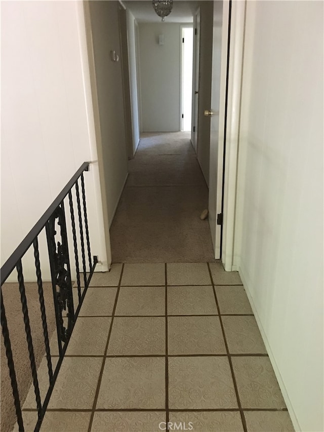 hall with tile patterned flooring