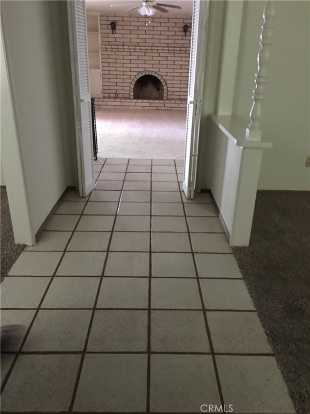 hall with light tile patterned flooring