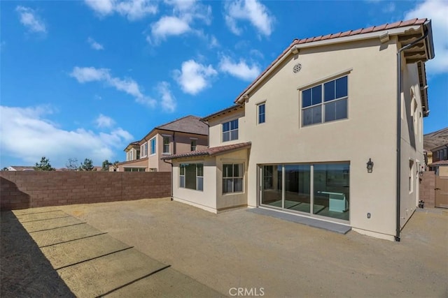 back of property featuring a patio area