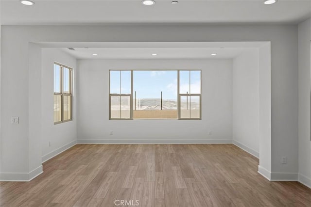 unfurnished room featuring light wood-type flooring