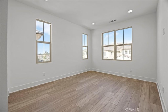 empty room with light wood-type flooring