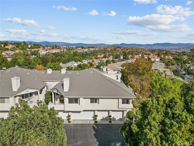 birds eye view of property featuring a mountain view