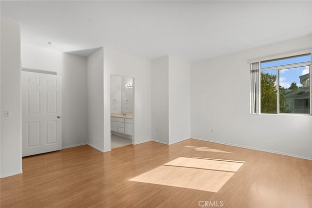 unfurnished room with light hardwood / wood-style floors