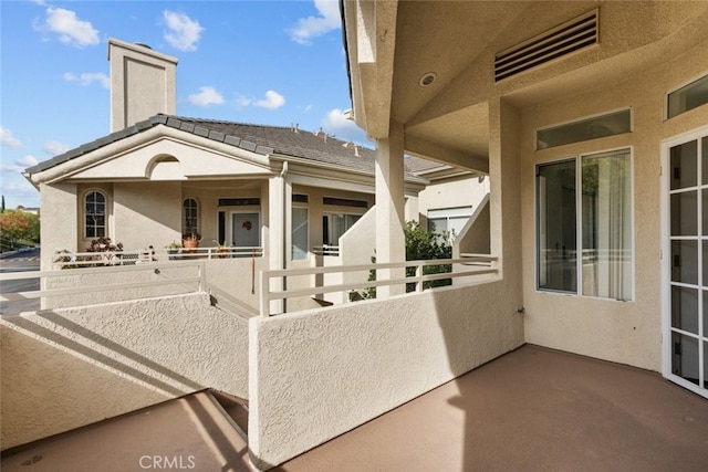 view of patio / terrace with a balcony