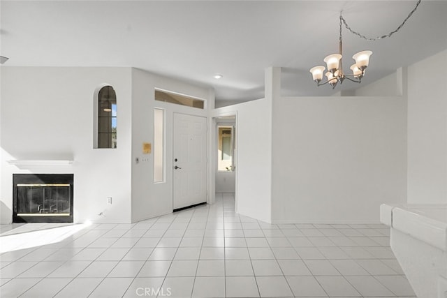 interior space with a chandelier and light tile patterned floors