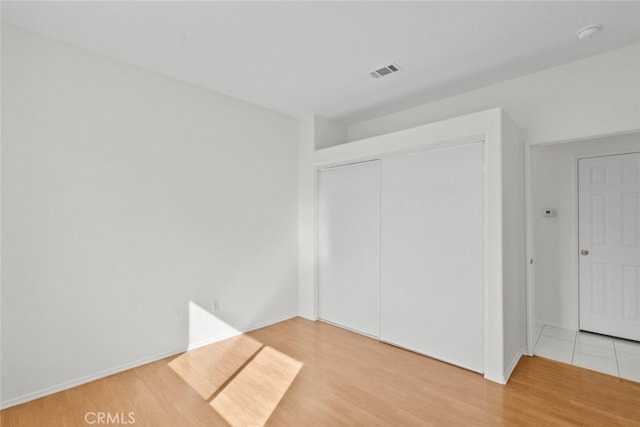 empty room featuring wood-type flooring