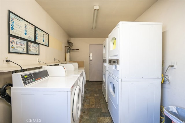 washroom featuring stacked washing maching and dryer and independent washer and dryer