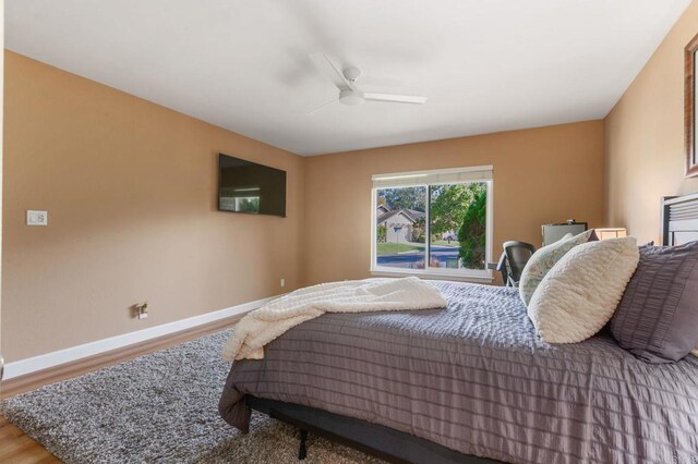 bedroom featuring ceiling fan and wood-type flooring