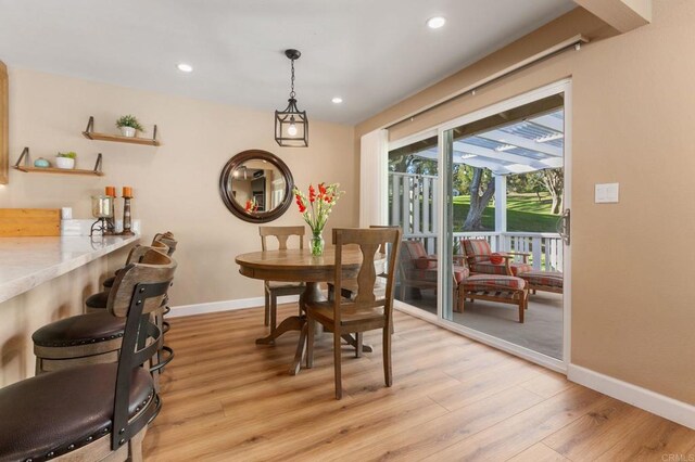 dining area with light wood-type flooring