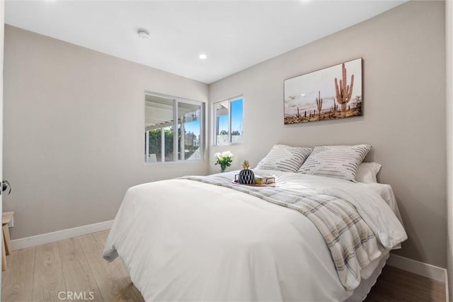 bedroom with light hardwood / wood-style flooring