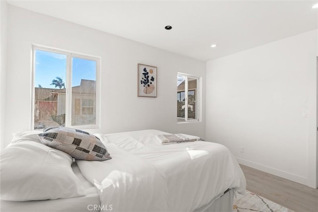 bedroom with light hardwood / wood-style flooring