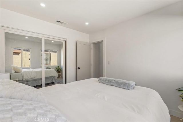 bedroom with hardwood / wood-style floors