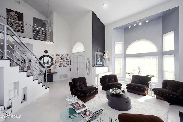 living room featuring high vaulted ceiling