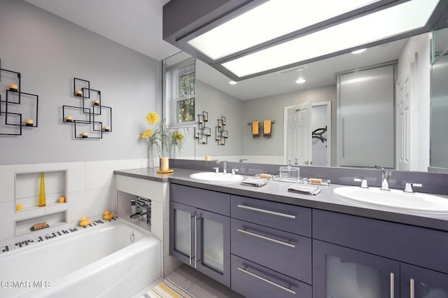 bathroom with a bathing tub and vanity