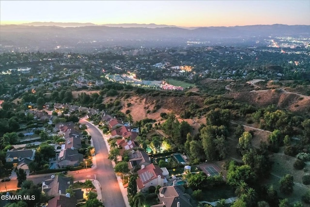 aerial view at dusk with a mountain view