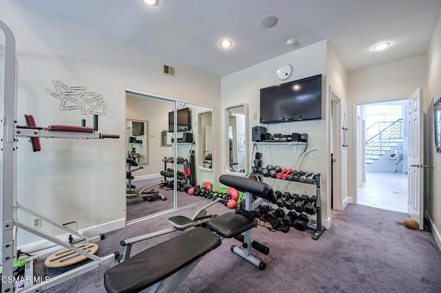 workout room featuring carpet flooring