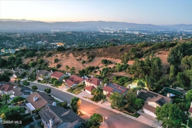 aerial view at dusk with a mountain view