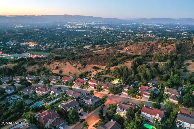 aerial view at dusk with a mountain view