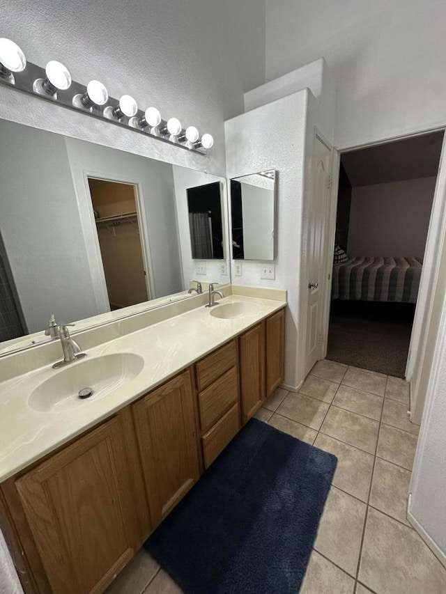 bathroom featuring tile patterned floors and vanity