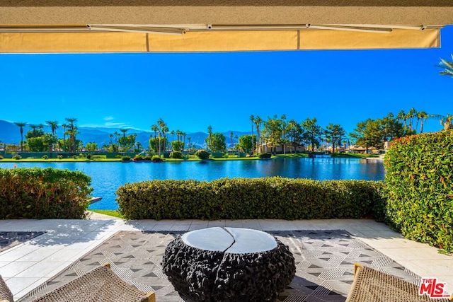 view of patio featuring a water view