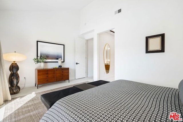 bedroom featuring high vaulted ceiling