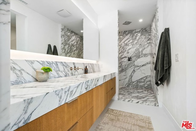 bathroom featuring vanity and walk in shower