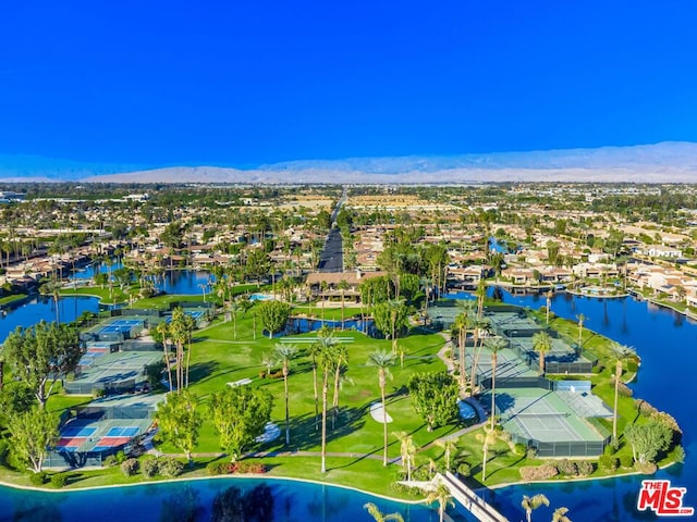 drone / aerial view with a water and mountain view