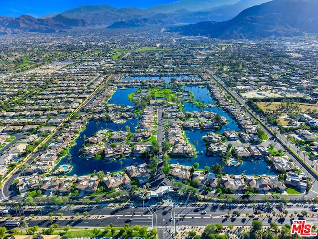 bird's eye view featuring a water and mountain view