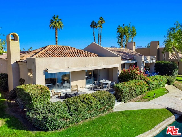 rear view of house featuring a patio area