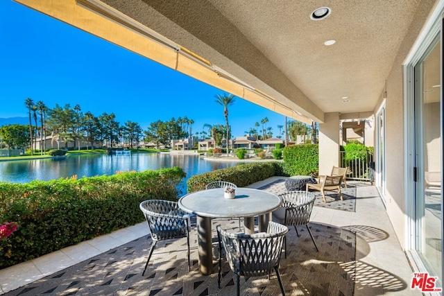 view of patio / terrace with a water view