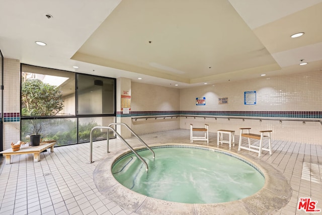 view of swimming pool with an indoor in ground hot tub