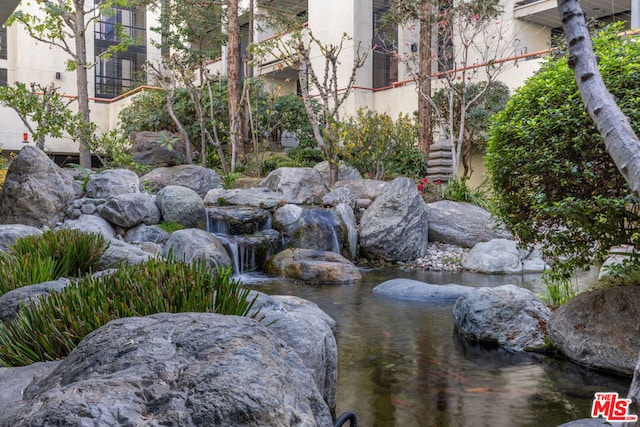 view of yard with a garden pond