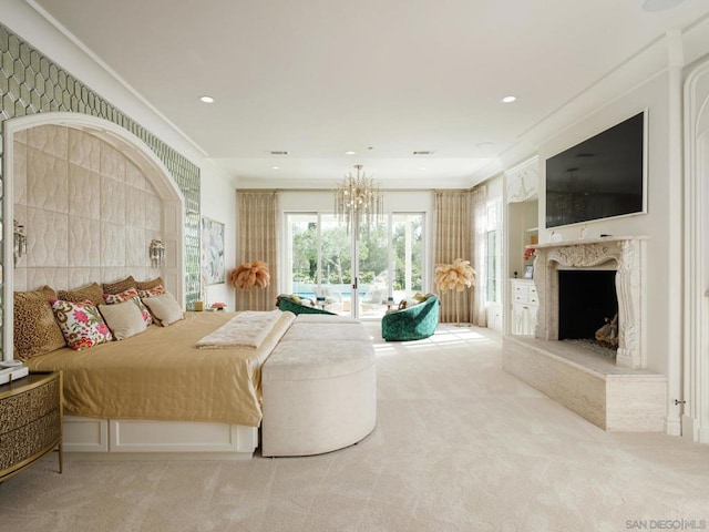 bedroom with a chandelier, light carpet, and a premium fireplace