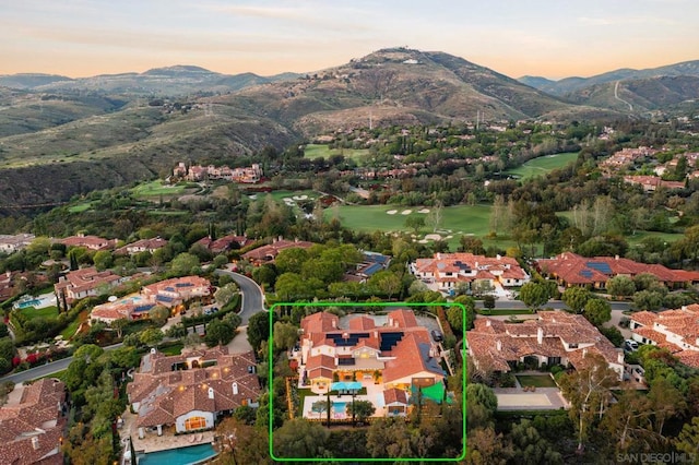 aerial view at dusk with a mountain view