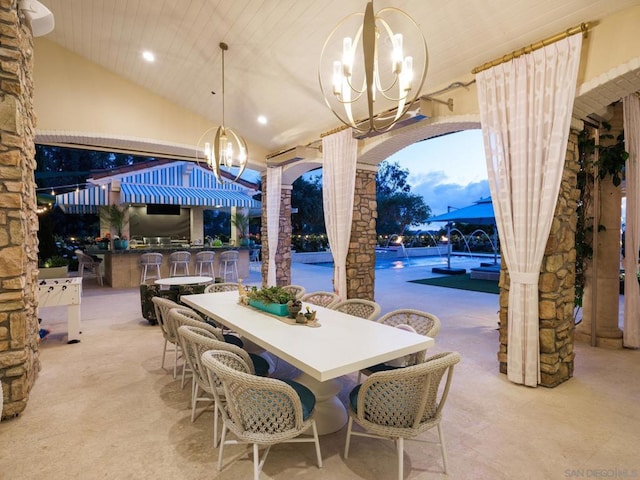 view of patio / terrace with pool water feature and exterior bar