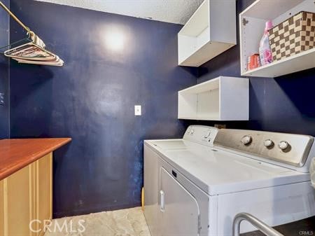 laundry room with independent washer and dryer