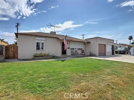 ranch-style house with a garage and a front yard